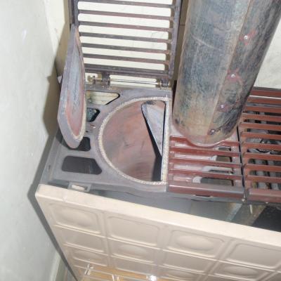 Photo Asbest-Schnur bei Öffnung von Öl-Ofen